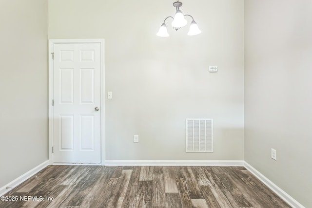 95886 Graylon Dr, Yulee, FL 32097 - unfurnished room with wood finished floors and a chandelier