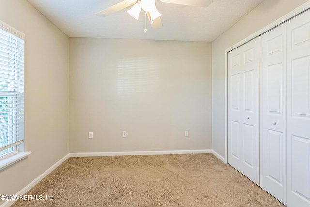 95886 Graylon Dr, Yulee, FL 32097 - unfurnished bedroom featuring carpet, a closet, and a ceiling fan