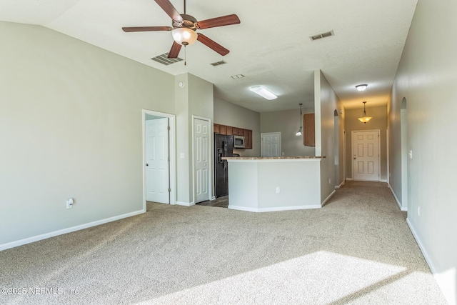 95886 Graylon Dr, Yulee, FL 32097 - unfurnished living room featuring carpet floors, a ceiling fan, and arched walkways
