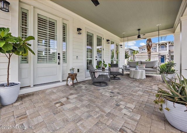1639 Maritime Oak Dr, Atlantic Beach, FL 32233 - covered porch with a ceiling fan and an outdoor living space