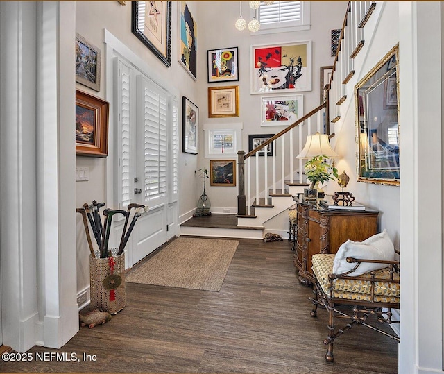 1639 Maritime Oak Dr, Atlantic Beach, FL 32233 - entrance foyer featuring stairway, dark wood-style floors, and a high ceiling