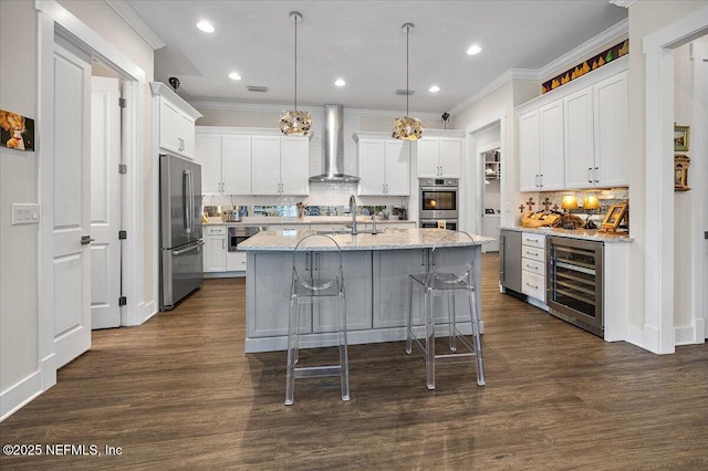 1639 Maritime Oak Dr, Atlantic Beach, FL 32233 - kitchen featuring beverage cooler, decorative backsplash, ornamental molding, a center island with sink, and stainless steel appliances