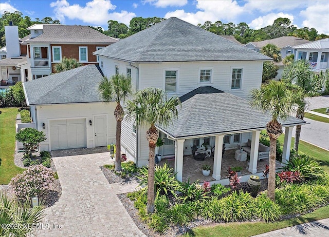 1639 Maritime Oak Dr, Atlantic Beach, FL 32233 - view of front of home with roof with shingles, a garage, decorative driveway, and a residential view