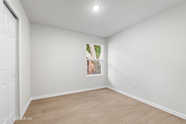 8077 Devoe St, Jacksonville, FL 32220 - unfurnished bedroom with light wood finished floors and a closet