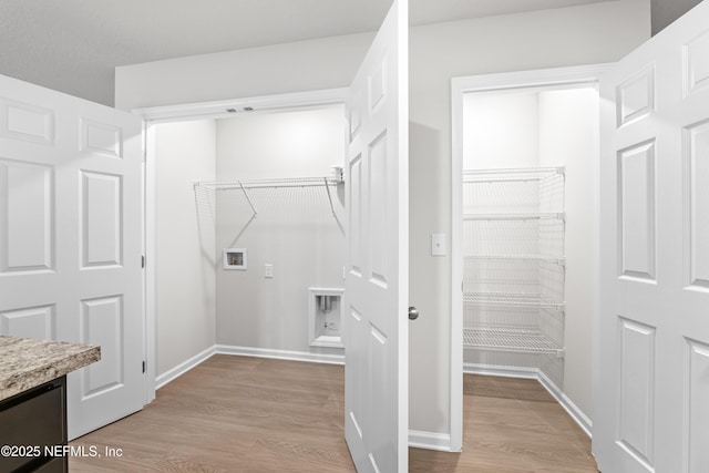 8077 Devoe St, Jacksonville, FL 32220 - laundry area with washer hookup and light wood-style flooring