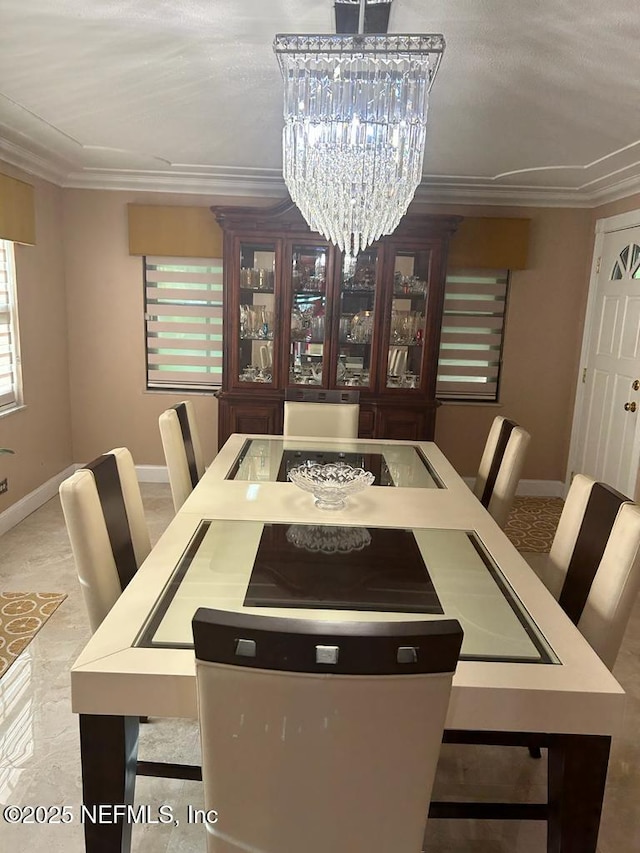 2788 SW 46th Ct, Fort Lauderdale, FL 33312 - dining space featuring ornamental molding and a chandelier