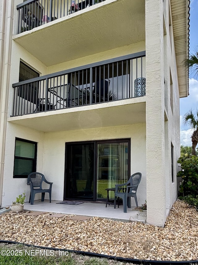 4250 A1A Unit R19, Saint Augustine, FL 32080 - back of house featuring a balcony and stucco siding