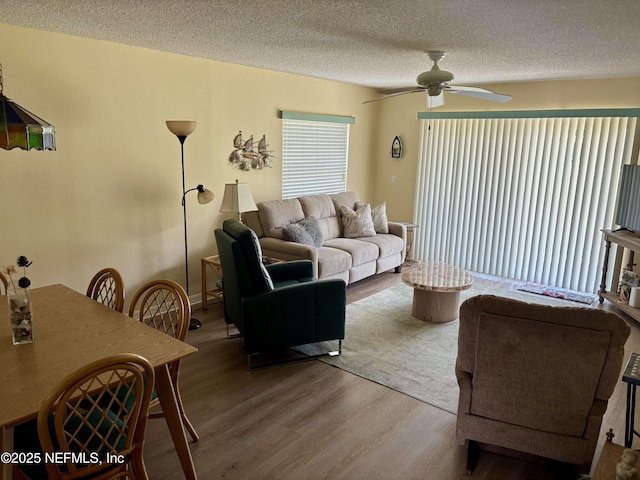 4250 A1A Unit R19, Saint Augustine, FL 32080 - living room with ceiling fan, wood finished floors, and a textured ceiling