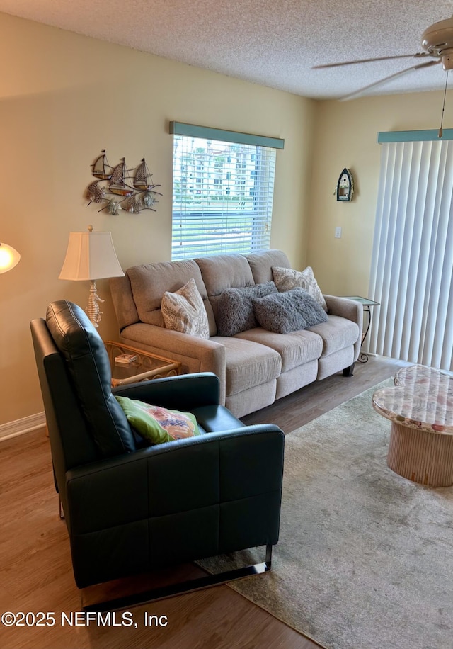 4250 A1A Unit R19, Saint Augustine, FL 32080 - living area with wood finished floors, a ceiling fan, and a textured ceiling