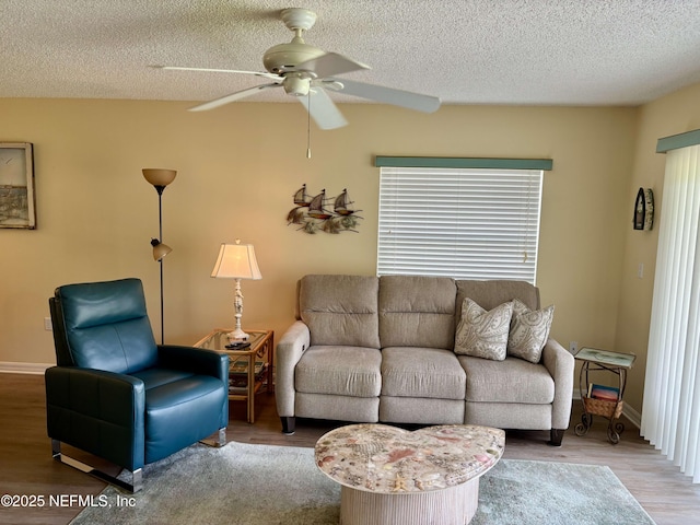 4250 A1A Unit R19, Saint Augustine, FL 32080 - living room with ceiling fan, wood finished floors, and a textured ceiling