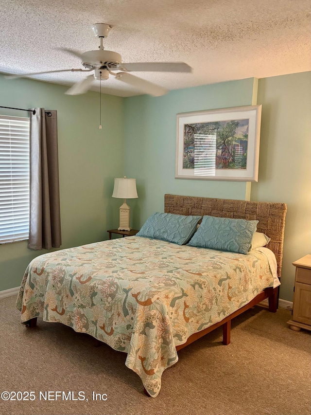 4250 A1A Unit R19, Saint Augustine, FL 32080 - bedroom with carpet flooring, a ceiling fan, and a textured ceiling