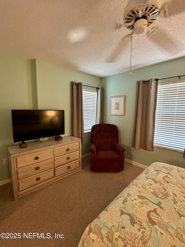 4250 A1A Unit R19, Saint Augustine, FL 32080 - bedroom featuring carpet flooring, a textured ceiling, and ceiling fan