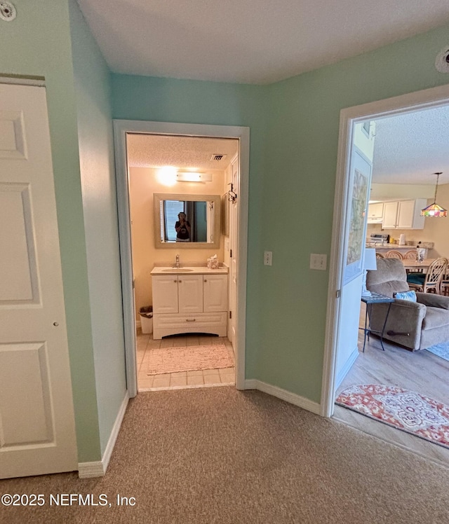 4250 A1A Unit R19, Saint Augustine, FL 32080 - corridor featuring light carpet and baseboards