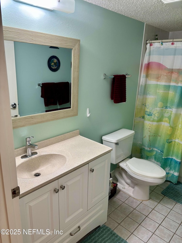 4250 A1A Unit R19, Saint Augustine, FL 32080 - full bath with vanity, tile patterned floors, a textured ceiling, and curtained shower