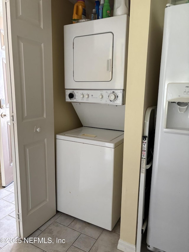 4250 A1A Unit R19, Saint Augustine, FL 32080 - laundry room with estacked washer and dryer and light tile patterned flooring