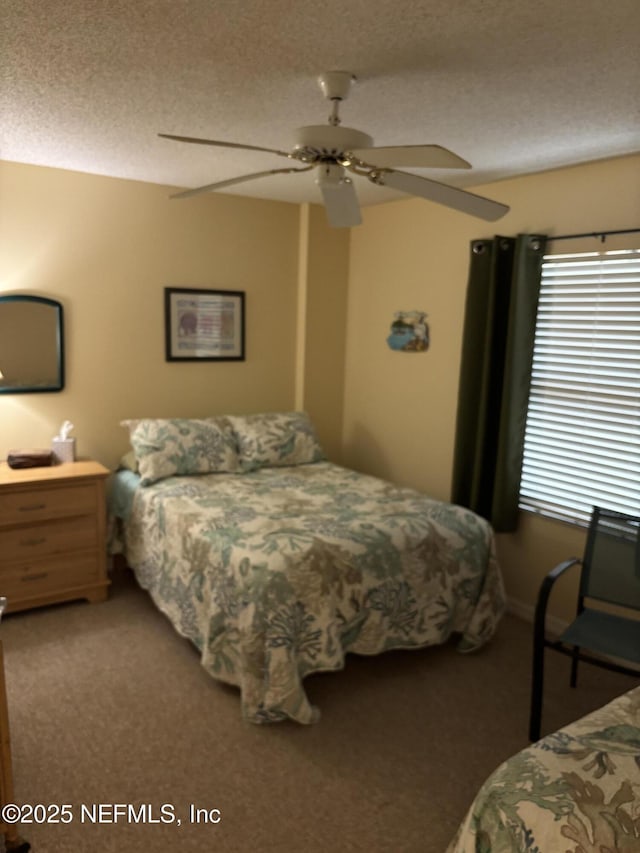 4250 A1A Unit R19, Saint Augustine, FL 32080 - carpeted bedroom with a textured ceiling and a ceiling fan