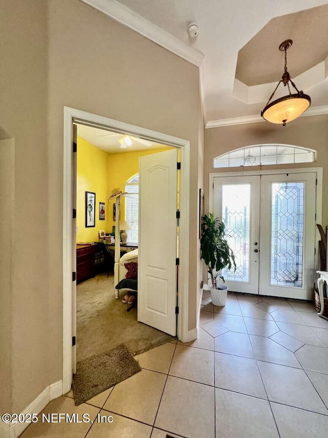 16325 Magnolia Bluff Dr, Montverde, FL 34756 - entryway with plenty of natural light, ornamental molding, french doors, and tile patterned flooring