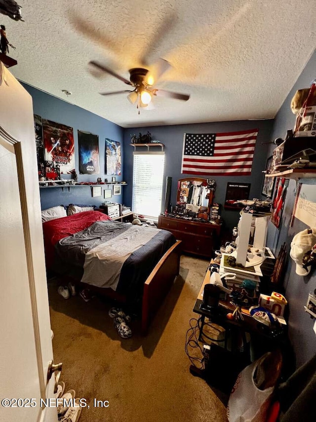 16325 Magnolia Bluff Dr, Montverde, FL 34756 - carpeted bedroom with a textured ceiling and a ceiling fan