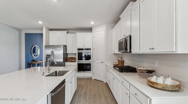 2769 Seasons Rd, Green Cove Springs, FL 32043 - kitchen featuring appliances with stainless steel finishes, white cabinetry, light countertops, recessed lighting, and light wood finished floors