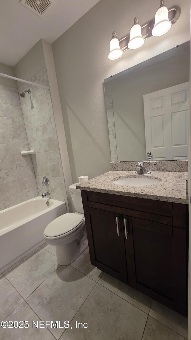 228 Clayton St, Brandon, FL 33511 - bathroom featuring vanity, tile patterned floors, and bathing tub / shower combination