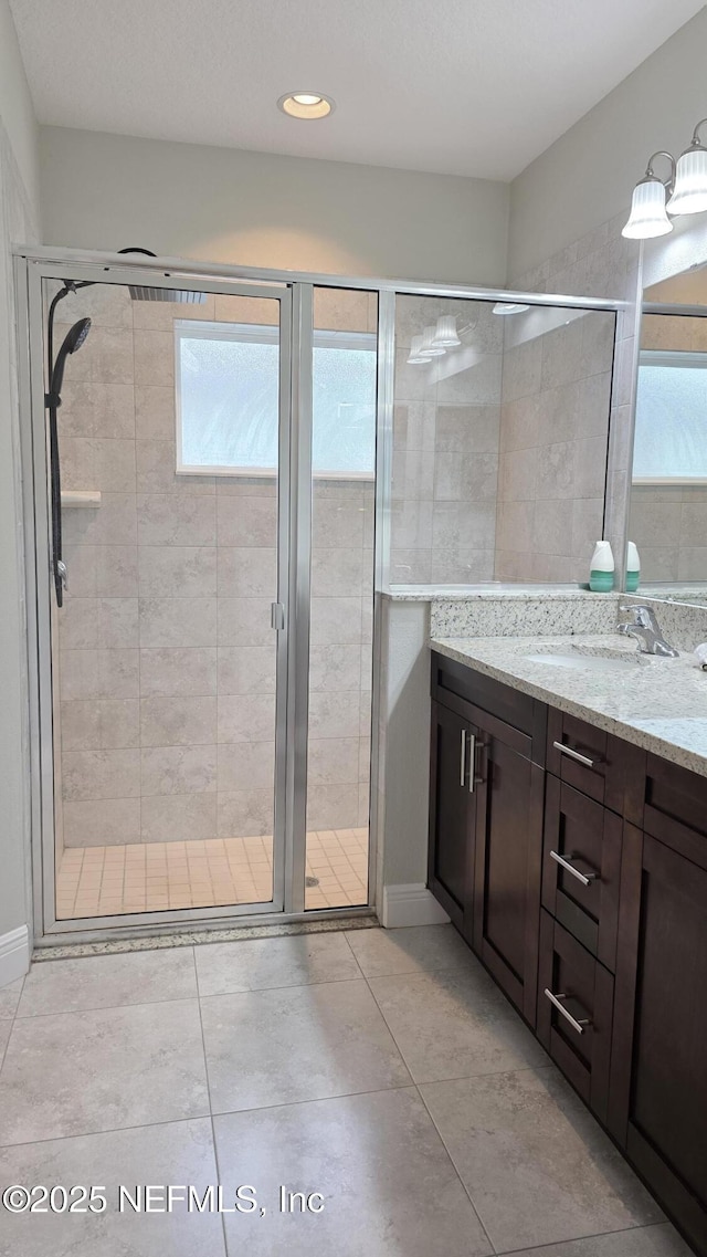 228 Clayton St, Brandon, FL 33511 - full bath featuring vanity, a shower stall, and tile patterned floors