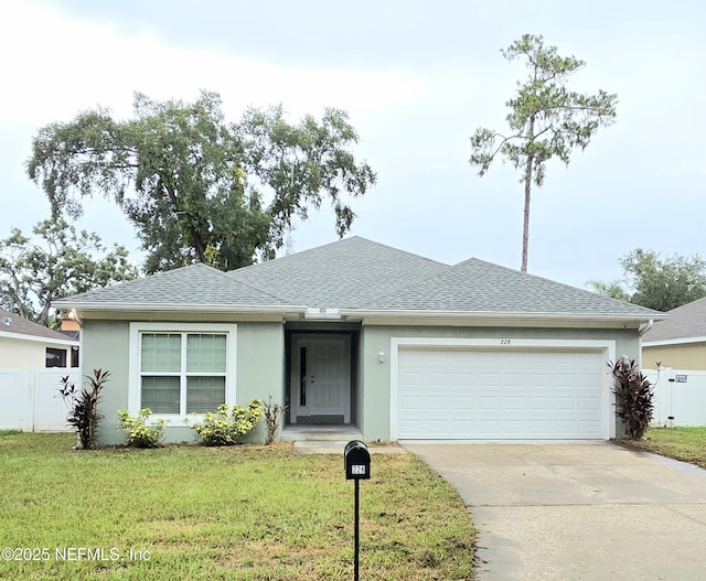 228 Clayton St, Brandon, FL 33511 - single story home featuring a shingled roof, stucco siding, driveway, and an attached garage