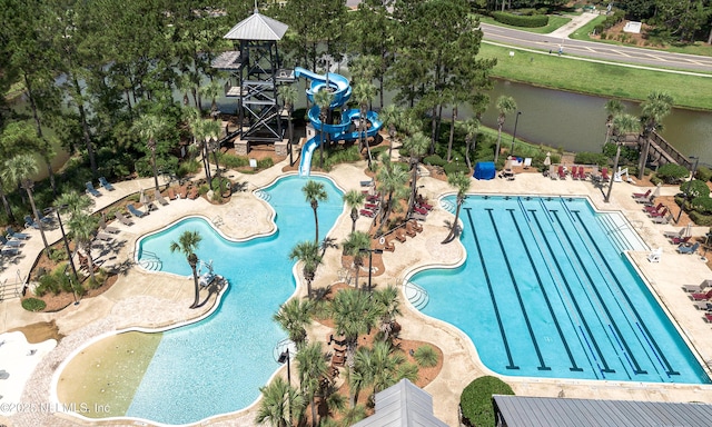 1361 Wekiva Way, Saint Augustine, FL 32092 - community pool with a water slide, a patio, and view of scattered trees