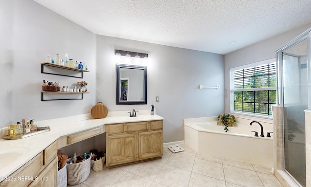 1361 Wekiva Way, Saint Augustine, FL 32092 - full bath featuring double vanity, a stall shower, a garden tub, a textured ceiling, and tile patterned floors