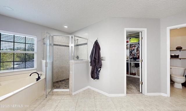 1361 Wekiva Way, Saint Augustine, FL 32092 - full bathroom featuring a garden tub, tile patterned flooring, a stall shower, a walk in closet, and a textured ceiling