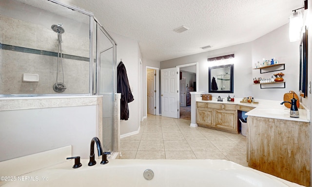 1361 Wekiva Way, Saint Augustine, FL 32092 - full bathroom featuring a shower stall, vanity, tile patterned flooring, a textured ceiling, and a tub