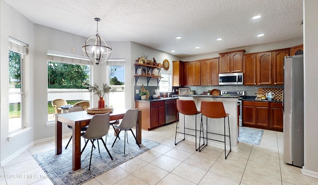 1361 Wekiva Way, Saint Augustine, FL 32092 - kitchen with open shelves, plenty of natural light, stainless steel appliances, a kitchen island, and recessed lighting