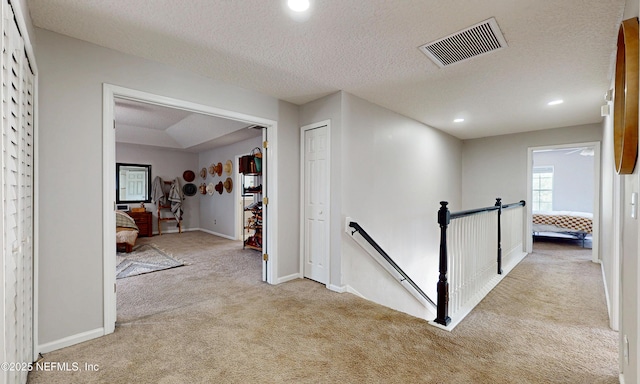 1361 Wekiva Way, Saint Augustine, FL 32092 - hall featuring carpet floors, an upstairs landing, recessed lighting, and a textured ceiling