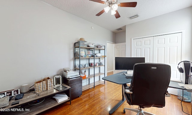 1361 Wekiva Way, Saint Augustine, FL 32092 - home office with wood finished floors, a ceiling fan, and a textured ceiling