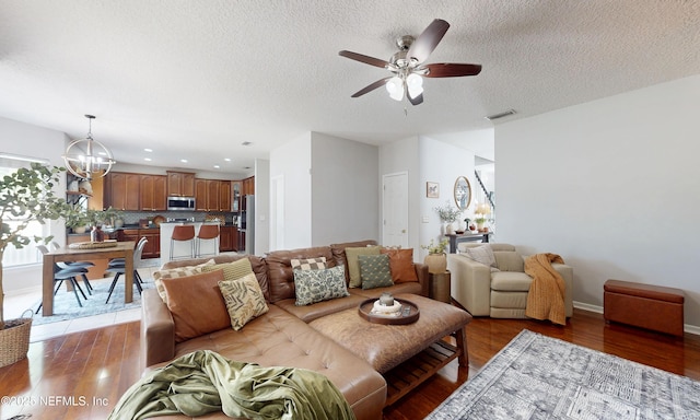 1361 Wekiva Way, Saint Augustine, FL 32092 - living area featuring a ceiling fan, dark wood-style flooring, a chandelier, a textured ceiling, and recessed lighting