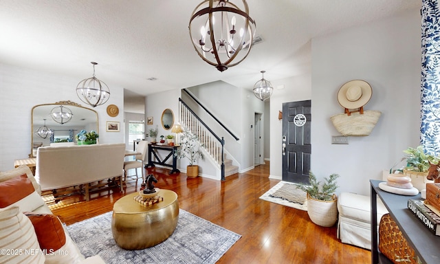 1361 Wekiva Way, Saint Augustine, FL 32092 - living room with a chandelier, stairway, and wood finished floors