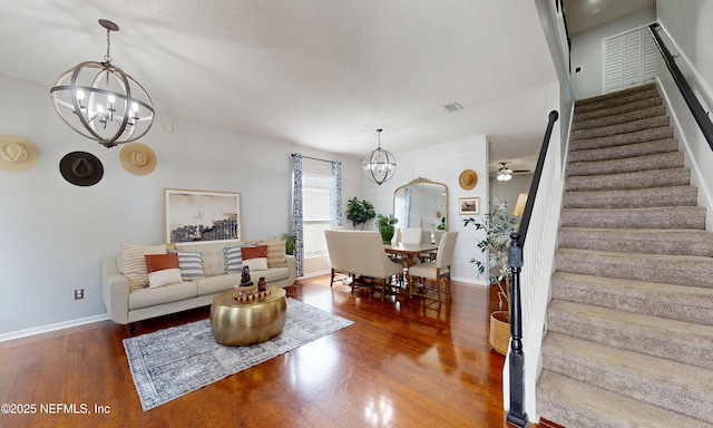 1361 Wekiva Way, Saint Augustine, FL 32092 - living area featuring a chandelier, stairway, wood finished floors, and ceiling fan