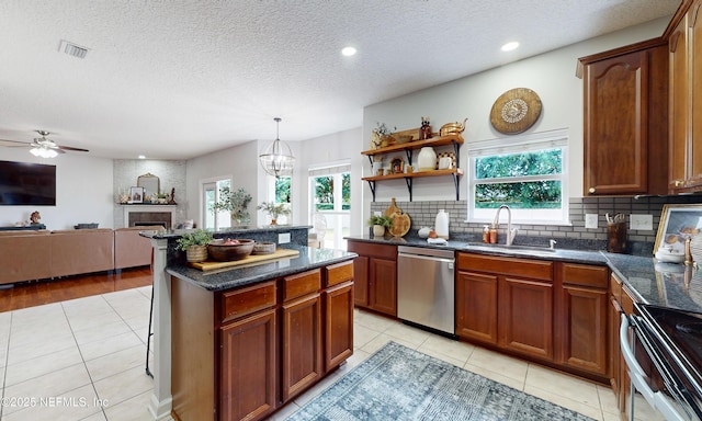 1361 Wekiva Way, Saint Augustine, FL 32092 - kitchen featuring stove, light tile patterned floors, dishwasher, tasteful backsplash, and a textured ceiling
