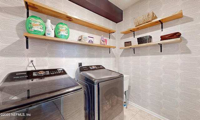1361 Wekiva Way, Saint Augustine, FL 32092 - laundry area featuring washer and clothes dryer, wallpapered walls, and light tile patterned flooring