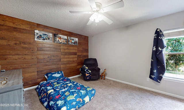 1361 Wekiva Way, Saint Augustine, FL 32092 - bedroom featuring wooden walls, carpet flooring, a textured ceiling, and ceiling fan