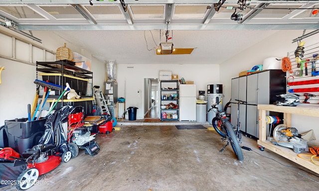 1361 Wekiva Way, Saint Augustine, FL 32092 - garage with freestanding refrigerator and a garage door opener
