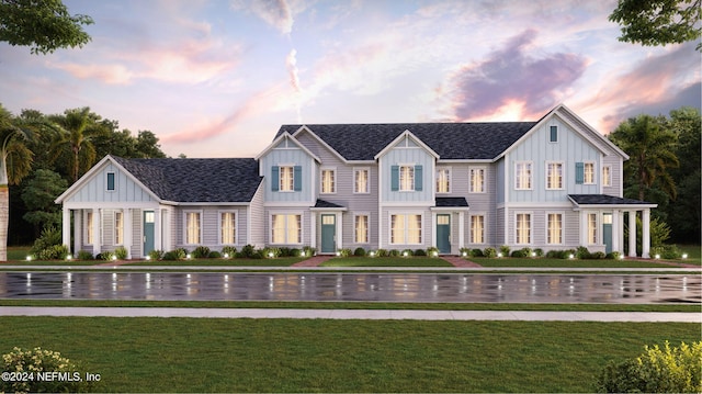 39 Hogan Ct, Saint Augustine, FL 32092 - modern farmhouse with board and batten siding, a front yard, and a shingled roof