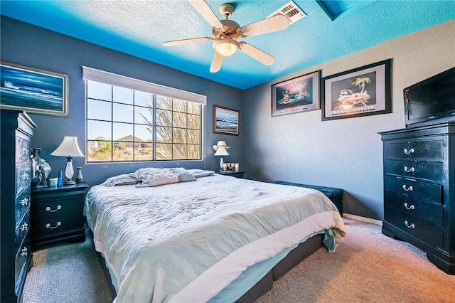 4390 El Camino Rd, Bullhead City, AZ 86429 - carpeted bedroom with a textured ceiling and ceiling fan