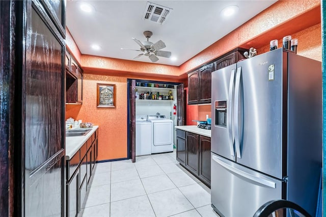 4390 El Camino Rd, Bullhead City, AZ 86429 - kitchen with stainless steel fridge, separate washer and dryer, light countertops, a textured wall, and light tile patterned floors