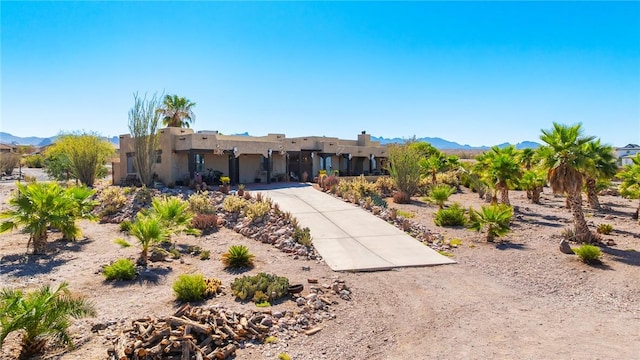 4390 El Camino Rd, Bullhead City, AZ 86429 - pueblo revival-style home with stucco siding and a mountain view