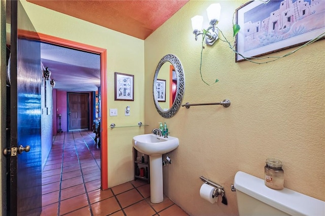 4390 El Camino Rd, Bullhead City, AZ 86429 - half bathroom with tile patterned floors and a textured wall