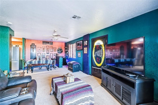 4390 El Camino Rd, Bullhead City, AZ 86429 - carpeted living area with ceiling fan and a textured ceiling
