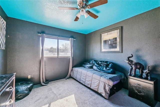 4390 El Camino Rd, Bullhead City, AZ 86429 - bedroom with a textured wall, carpet flooring, ceiling fan, and a textured ceiling