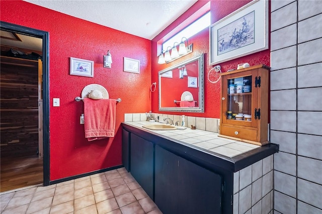4390 El Camino Rd, Bullhead City, AZ 86429 - bathroom with a textured wall and vanity