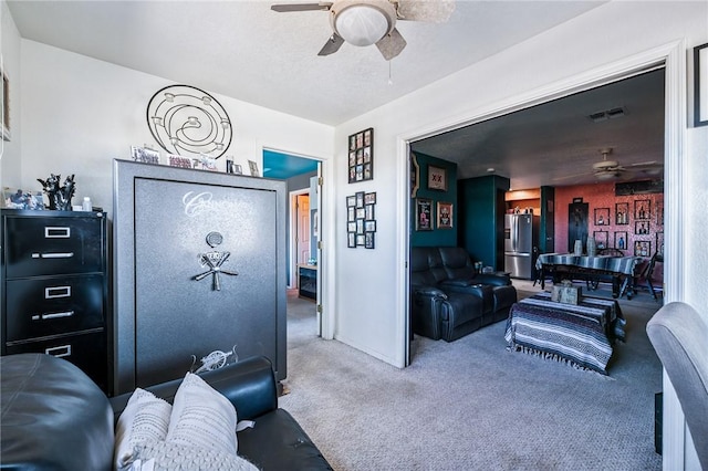 4390 El Camino Rd, Bullhead City, AZ 86429 - carpeted living area featuring a ceiling fan