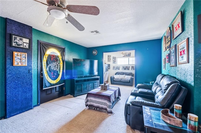 4390 El Camino Rd, Bullhead City, AZ 86429 - carpeted living area featuring a textured ceiling and ceiling fan
